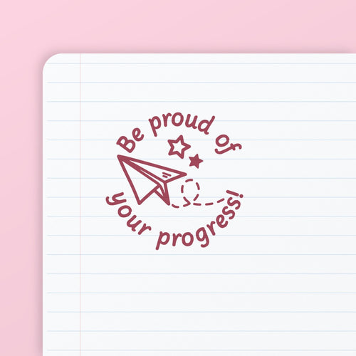 Red ink impression from the Be Proud Stamp, on lined paper. My Teacher Says, handmade in Scotland.