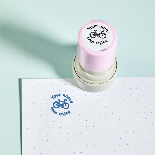 Bicycle Keep Trying Stamp — the teacher marking stamp shown with its blue ink impression on dotted paper. My Teacher Says, handmade in Scotland.