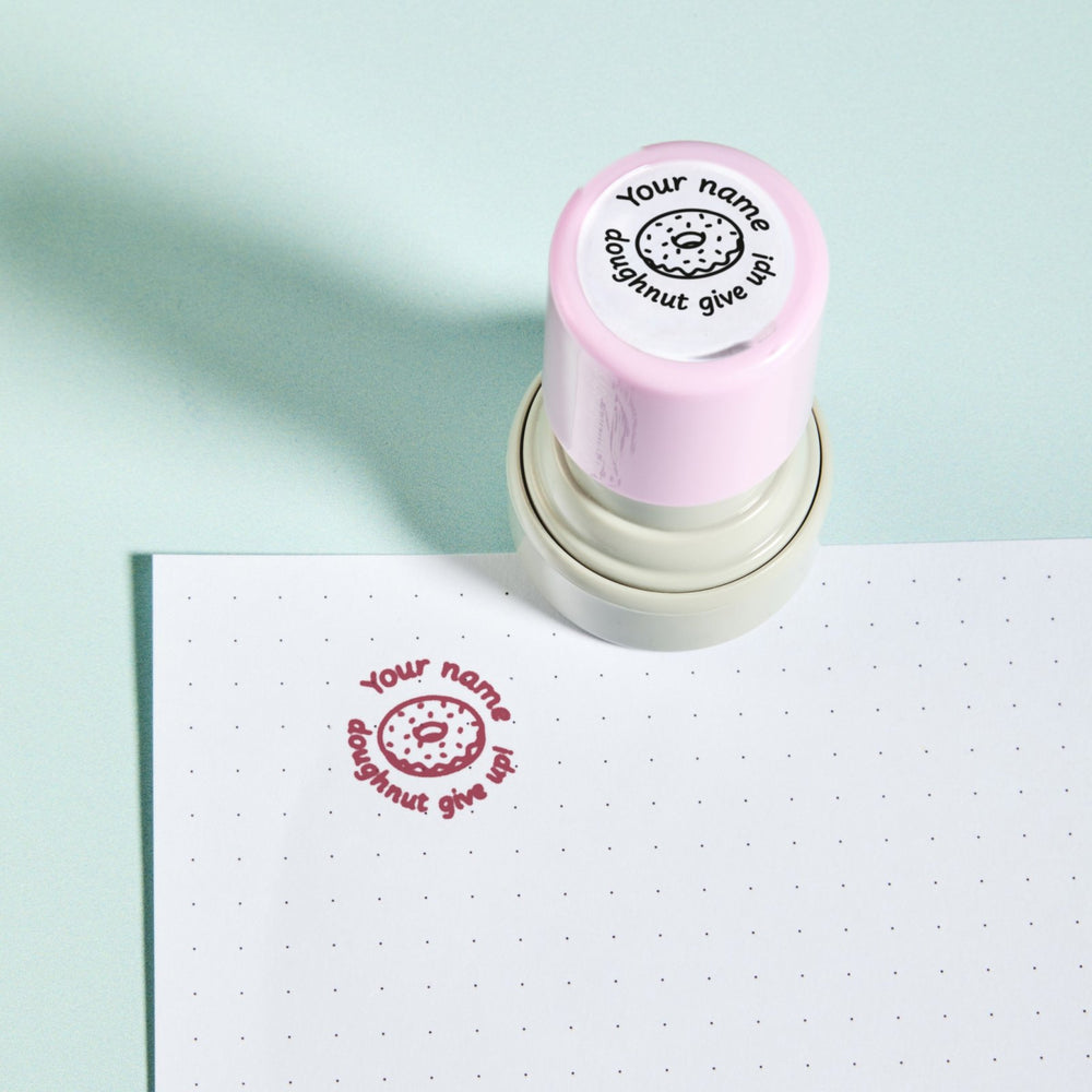 Doughnut Give Up Stamp — the teacher marking stamp shown with its pink ink impression on dotted paper. My Teacher Says, handmade in Scotland.