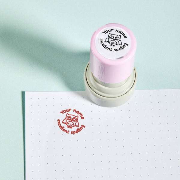 Excellent Spelling Stamp — the teacher marking stamp shown with its red ink impression on dotted paper. My Teacher Says, handmade in Scotland.