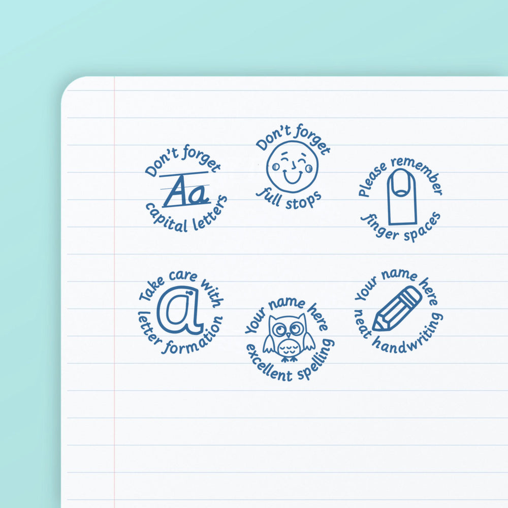 Literacy Set 3 - the six teacher marking stamps in the set, stamped in blue ink on lined paper: capital letters, full stops, finger spaces, letter formation, excellent spelling and neat handwriting. My Teacher Says, handmade in Scotland.