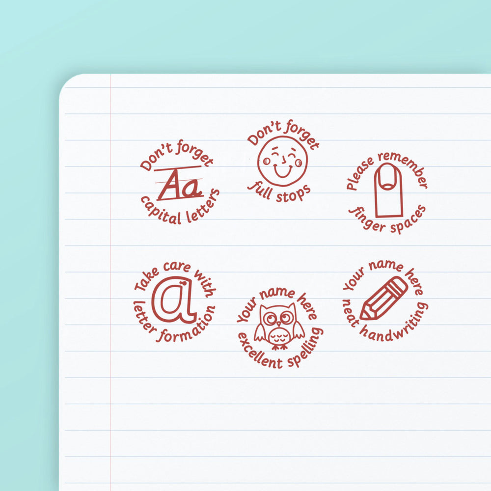 Literacy Set 3 - the six teacher marking stamps in the set, stamped in red ink on lined paper: capital letters, full stops, finger spaces, letter formation, excellent spelling and neat handwriting. My Teacher Says, handmade in Scotland.