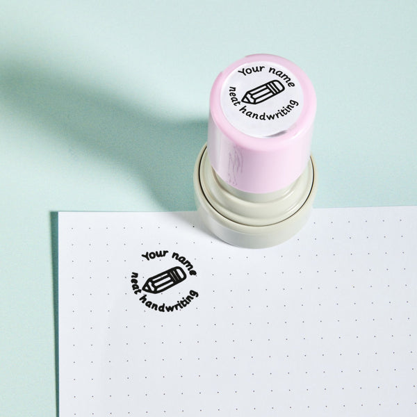 Neat Handwriting Stamp — the teacher marking stamp shown with its black ink impression on dotted paper. My Teacher Says, handmade in Scotland.