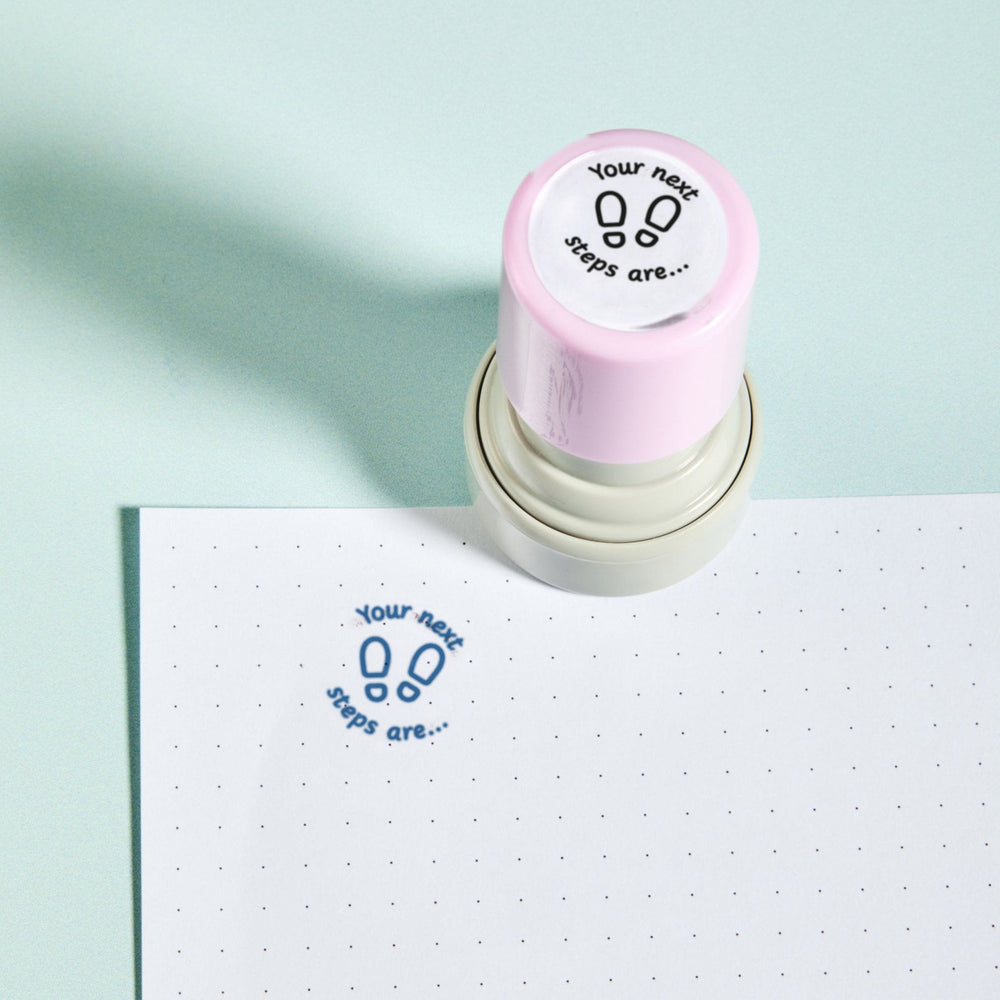 Next Steps Stamp - the teacher marking stamp reading 'Your next steps are...', shown with its blue ink impression on dotted paper. My Teacher Says, handmade in Scotland.