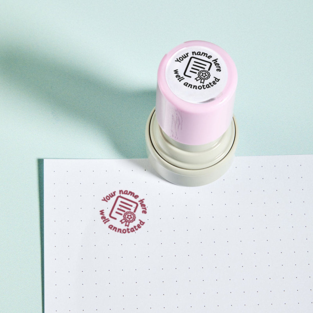 Well Annotated Stamp - the personalised teacher marking stamp reading 'Your name here - well annotated', shown with its pink ink impression on dotted paper. My Teacher Says, handmade in Scotland.